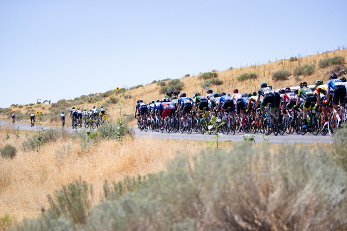 The peloton heads up the loop on the island that passes by the beaches of Antelope. Stage 3 of the 2019 Tour of Utah. Photo by Cathy Fegan-Kim