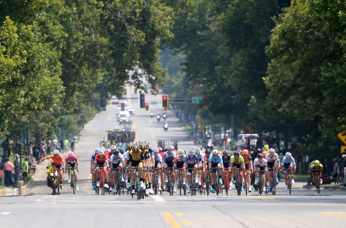 The peloton charges through Downtown SLC. 2018 Tour of Utah Stage 4, August 8, 2018, Salt Lake City, Utah. Photo by Cathy Fegan-Kim, cottonsoxphotography.net