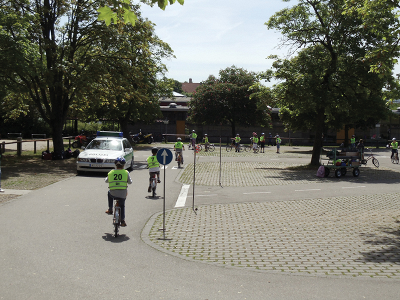 Rad schule or bike school; note the police car.