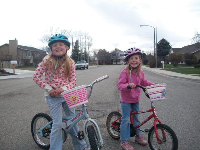 The Barrett girls on bikes.