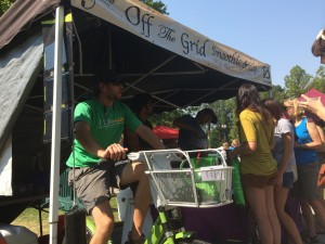 Off the Grid uses a Greenbike to power a blender at the Salt Lake City Farmer's Market on July 19, 2014. They make healthy, high quality smoothies.  Photo by Dave Iltis 