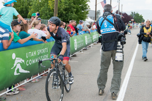 A Hincapie Team rider giving the "low five" to the fans along the finish line. Photo by Dave Richards, daverphoto.com