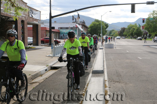 Cyclists riding on Salt Lake City's new protected bike lane on 300 S. Cycling helps our air and health. Photo by Dave Iltis