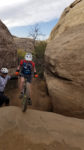 Heather riding right up a wall on Guacamole Mesa. Photo by Lukas Brinkerhoff