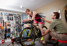 John Higgins takes measurements during a bike fit at the Bike Fitr studio. Photo by Derek Israelsen Photography