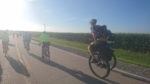 Guys on unicycles. RAGBRAI 2018. Photo by John Monroe