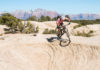 Hurricane Mountain Bike Festival is Set for March 29-31, 2019 in Hurricane, Utah A certified IMBA Epic, the Gooseberry Mesa trail system is a must-do, classic ride. In this photo, Park City resident, Todd Winzenried, drops in on a slickrock halfpipe on Gooseberry's North Rim Trail, with the cliffs of Zion National Park in the background. Photo by John Shafer/Photo-John.net