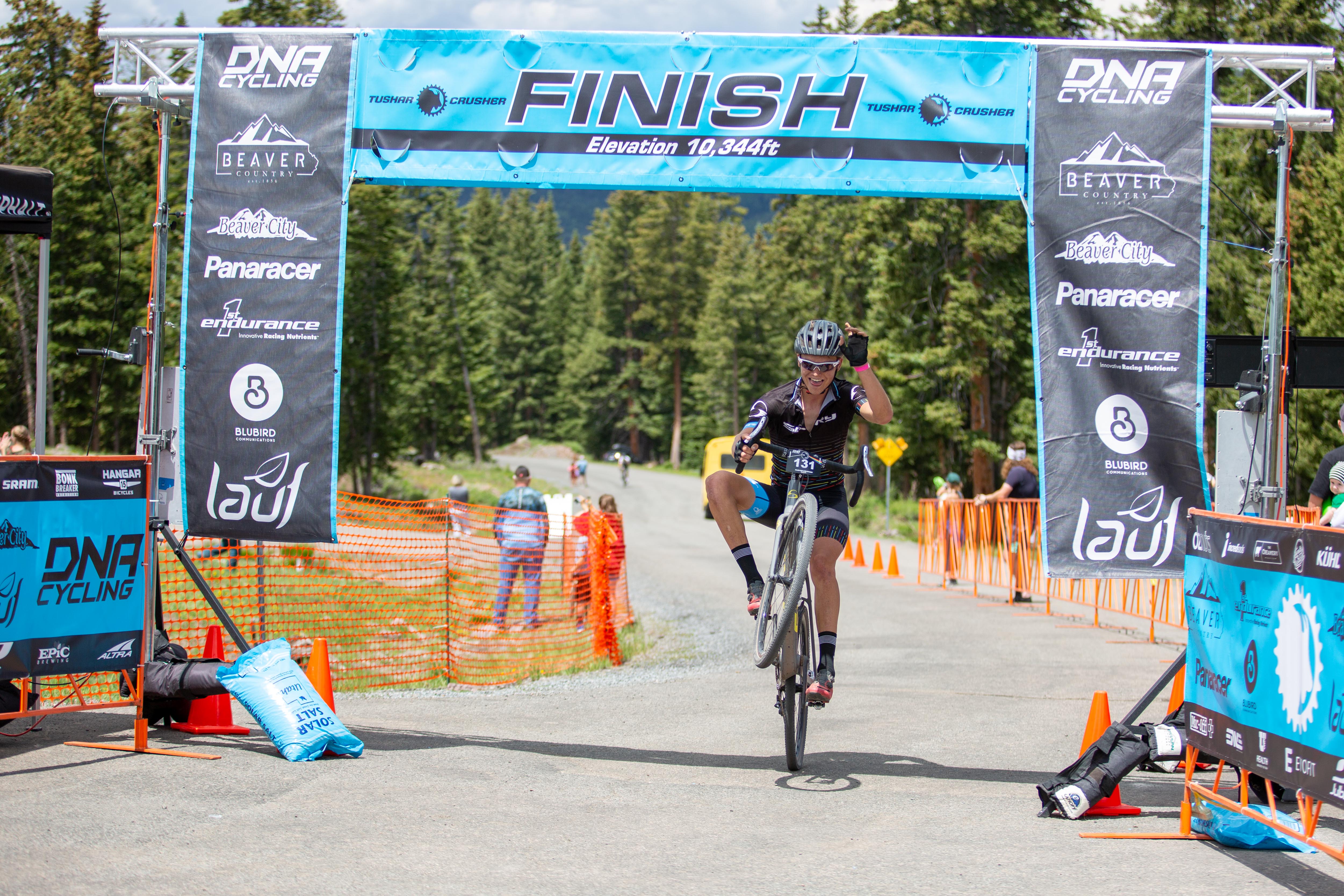 18-year old Andrew Conover pops a wheelie coming across the line to win the 29 and Under age group. Photo: Angie Harker.