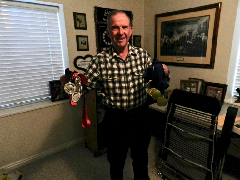 Stan Swallow with a variety of medals from National Championships and more. Photo by Brian Thompson