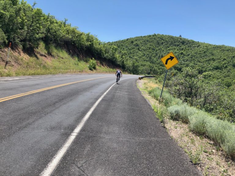 A cyclist descends Emigration Canyon with no cars around. Photo by Dave Iltis