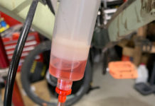 Hydraulic Brakes Require Preventative Maintenance Shimano Mineral Oil - Going in fresh, is translucent pink, ideally when it comes out in the next bleed, it should still be transparent. Photo by Eric Ramirez