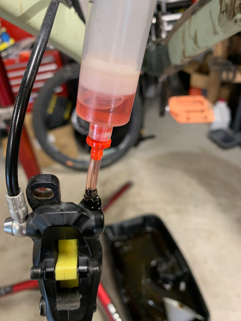 Shimano Mineral Oil - Going in fresh, is translucent pink, ideally when it comes out in the next bleed, it should still be transparent. Photo by Eric Ramirez