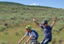 A New Perspective: How Adaptive Cycling Can Impact Lives Two National Ability Center riders cycling on tandem bike during summer 2019 cycling session. Photo by Berin Klawiter