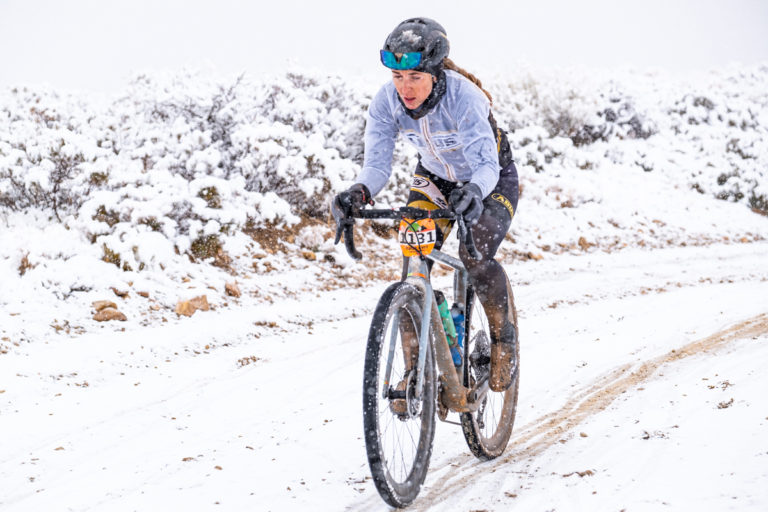 Lindsey Stevenson suffering in the snow storm during the 2021 True Grit Gravel event. Photo by Dave Amodt, True Grit Epic