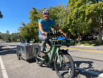 Christoph Heinrich on his way to a yard care job via ebike. Photo by Dave Iltis