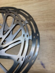 New rotor on top. Overheated, glazed rotor underneath. Photo by Tom Jow