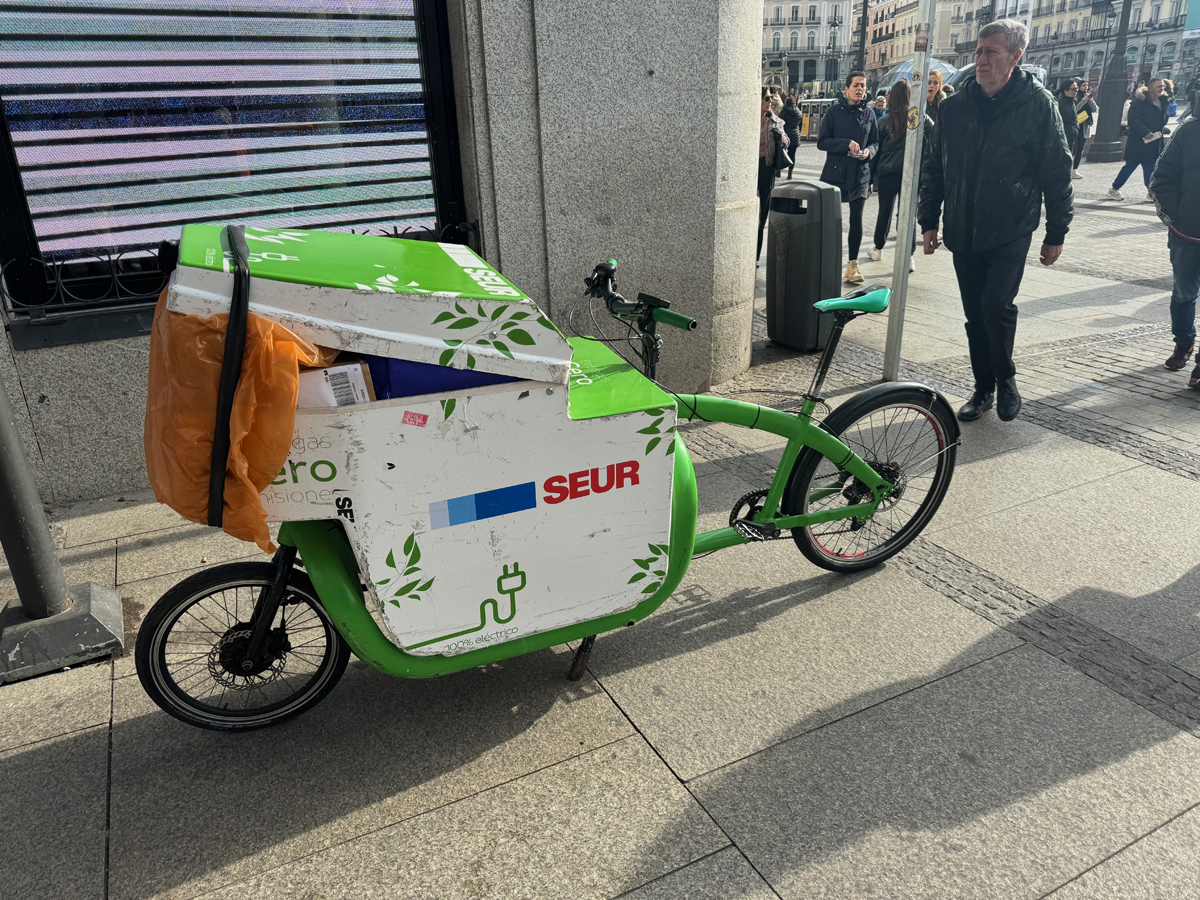 A Seur delivery bike. Cycling in Madrid, Spain, 2024. Photo by Dave Iltis
