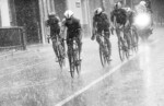 Riders persevere in the rain.